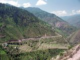 21 Two-Lane Road Through Fertile Green Countryside Kaghan Valley Ilys immediately transforms from an extremely cautious slow driver on dirt roads to a race car driver on paved roads swerving around each corner in the winding road. He has to be careful and watch out for children going to school, adults casually strolling, old men with canes, cows, goats, and donkeys on the edge of the road. Ilys had to constantly pass and avoid all manner of vehicles, including cars, jeeps, suvs, buses, trucks, vans, jeepneys, tractors, motorcycles, bicycles, and horse and donkey carts. The speed limit changed to 100 for the last 45km to Pindi as we drove on the 4-lane divided Peshawar Road to Pindi.